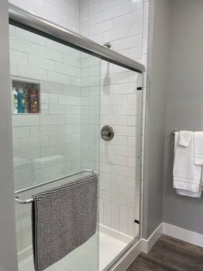Shower, hair dryer, towels, soap