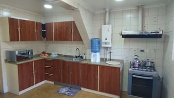Family Triple Room, City View | Private kitchen | Fridge, microwave