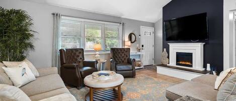 Älytelevisio, takka, videopelejä, pöytäjalkapallopöytä