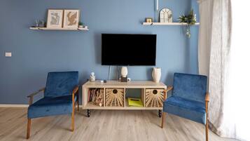 Apartment (One-Bedroom Apartment With Pool) | Living room | 32-inch flat-screen TV with cable channels