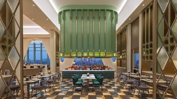 A modern restaurant with a central bar, seating area, and a view of the cityscape.