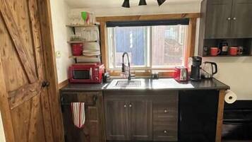 Fridge, microwave, stovetop, coffee/tea maker