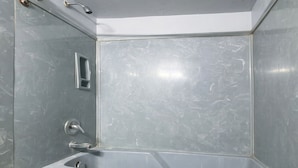 A bathroom with a shower, a sink, and a toilet. - Bama Motel Mobile I-65 & US-90 (Mobile)