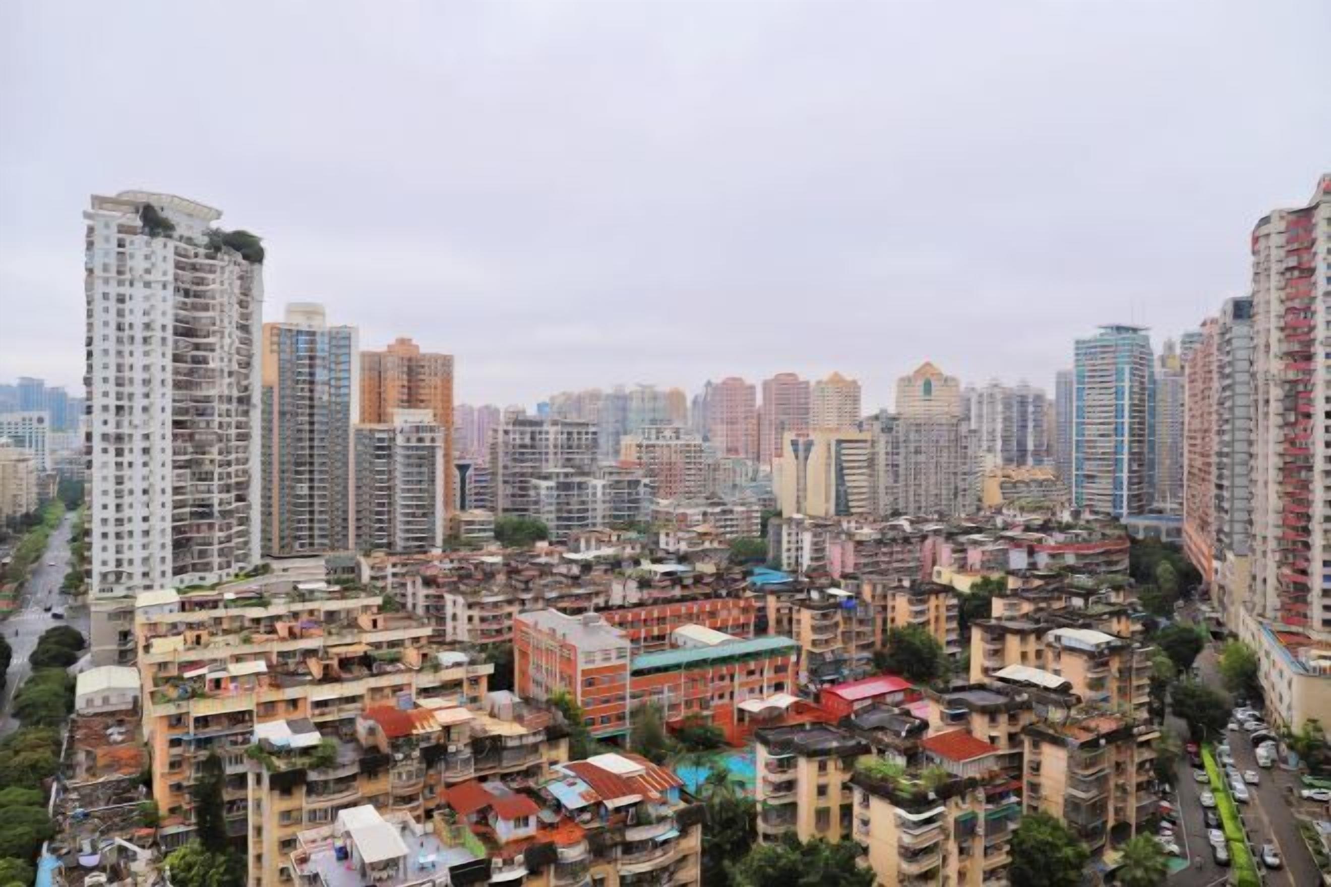 A densely packed urban area with high-rise residential buildings and a mix of older and newer structures.