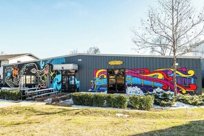 A building with colorful graffiti art on its exterior walls.