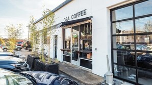 A coffee shop named OSA COFFEE with a storefront and large windows. - The Eastside 2BR Near 5Points (Nashville)