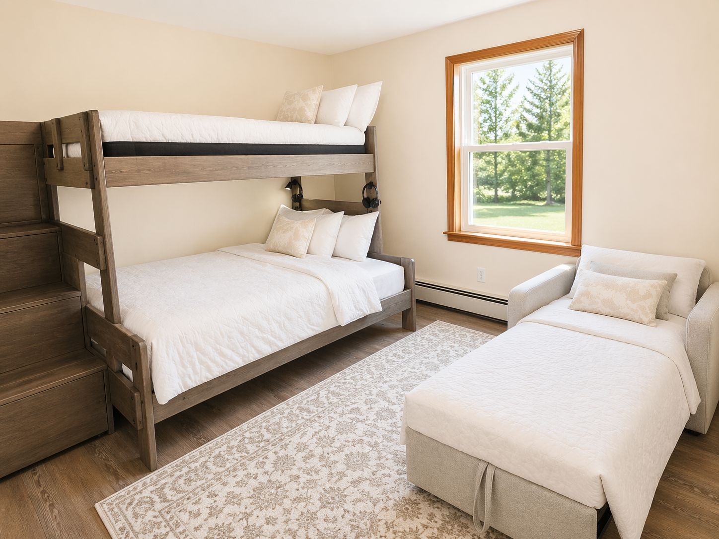 A bunk bed room with a window, a desk, and a chair.