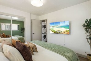 1 bedroom, desk, iron/ironing board, travel crib
