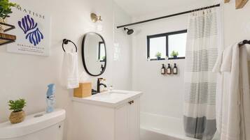 Shower, hair dryer, towels, shampoo