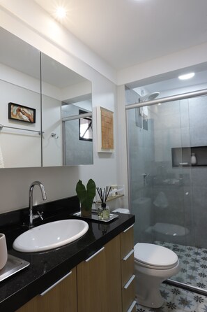 Shower, hair dryer, towels, toilet paper