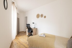 1 bedroom, desk, iron/ironing board, travel crib