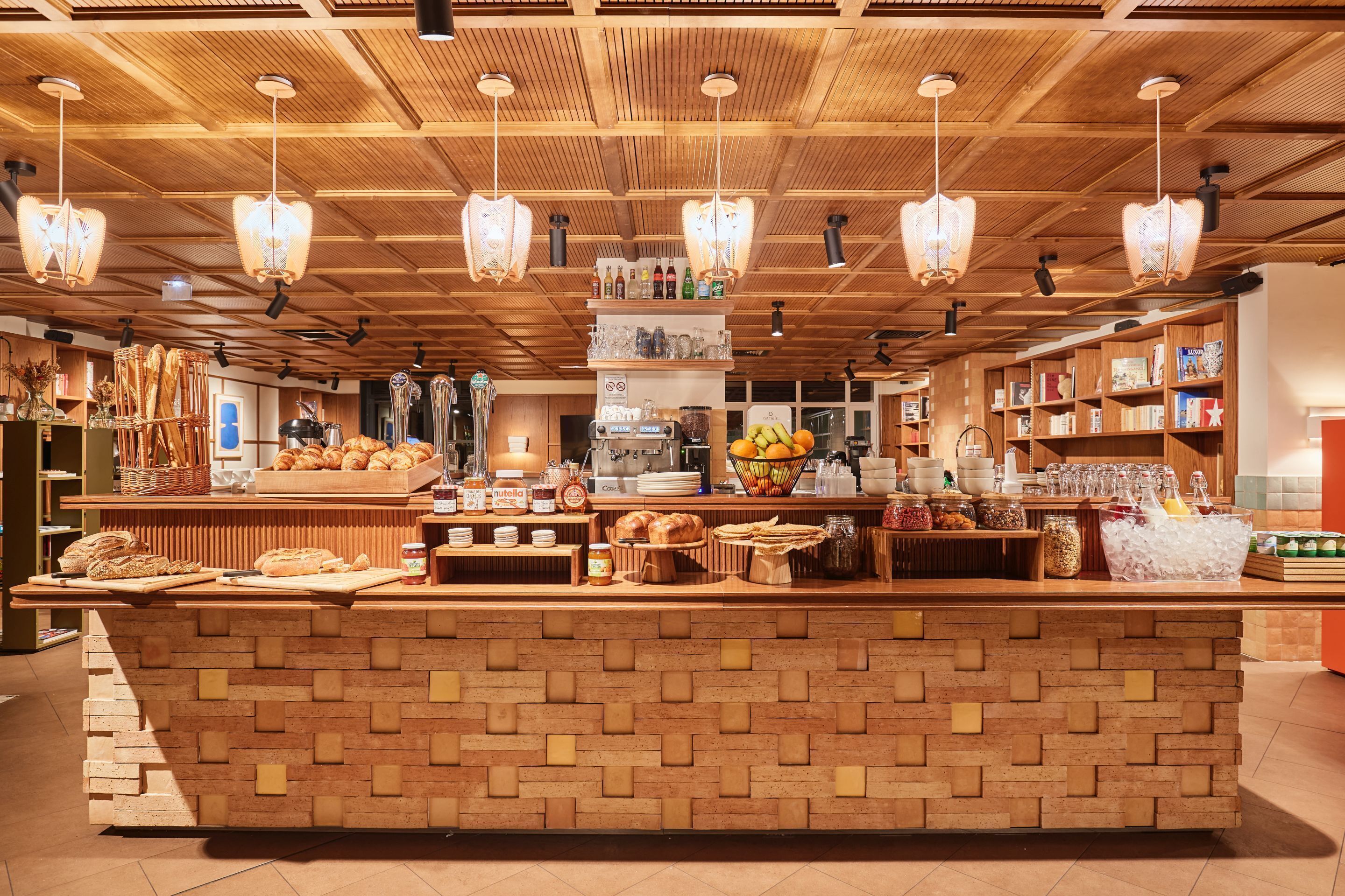 A bakery counter with various baked goods and beverages.