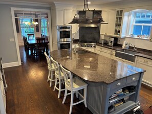 Cookware/dishes/utensils, ice maker, dining tables, kitchen islands