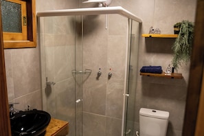 Shower, hair dryer, towels, toilet paper