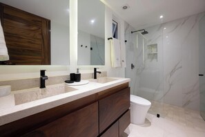 Shower, hair dryer, towels, toilet paper