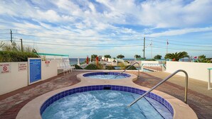 A pool area with two hot tubs, a sign prohibiting diving, and a view of the ocean. - Surfside G19 - Condo in Surfside Resort with Many Shared Amenities (Miramar Beach)