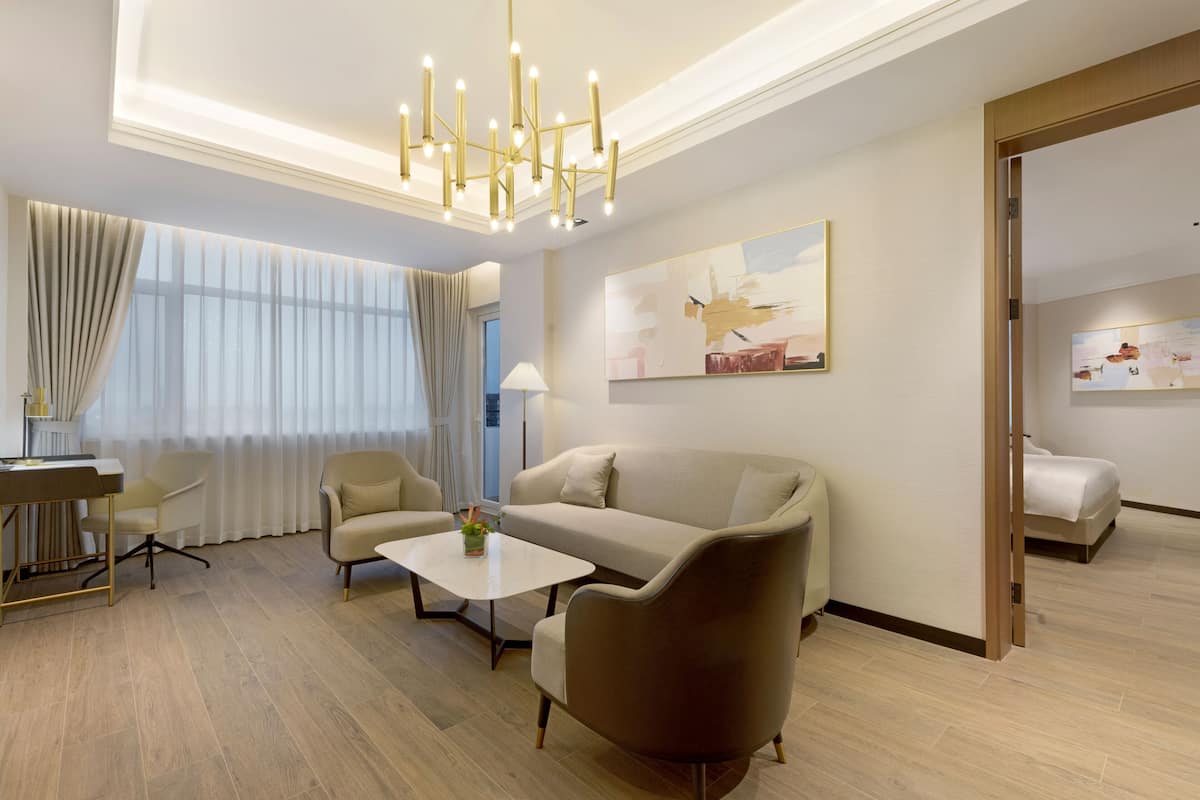 Suite, 1 King Bed, Balcony | In-room safe, desk, laptop workspace, blackout curtains