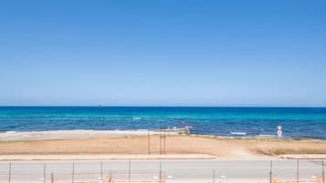Una spiaggia nelle vicinanze, teli da spiaggia