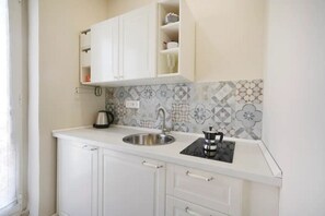 Fridge, stovetop, electric kettle, high chair