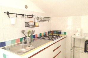 Fridge, cookware/dishes/utensils, dining tables