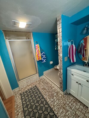 Shower, hair dryer, towels, soap