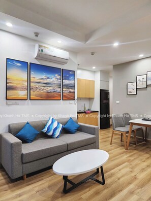 Family Apartment, Balcony, Beach View | Living area | Flat-screen TV - TMS QUY NHON- RUBY LUXURY SEA APARTMENT (Quy Nhon)