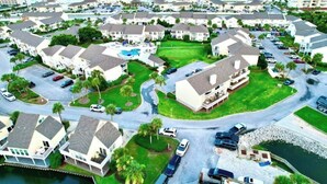 A coastal residential area with houses, a swimming pool, and a marina. - NEWLY RENOVATED 2BR 2BA CONDO - FREE BEACH SERVICE (Destin)