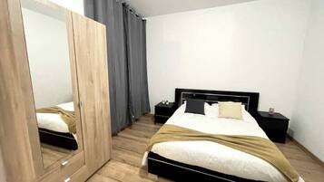 1 bedroom, desk, iron/ironing board, travel crib