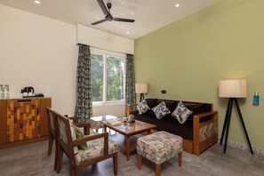 Presidential Suite, Garden View | Living area | 42-inch flat-screen TV with digital channels - The Golden Tusk By Ivory Destinations (Ramnagar)