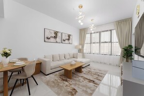 Departamento Deluxe, 1 habitación | Área de sala de estar