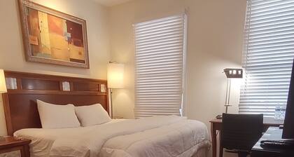 Guest Suite by Ameridency: 1 King Bed, 1 Bath with Rain Shower, Full Kitchen