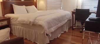 Guest Suite by Ameridency: 1 King Bed, 1 Bath with Rain Shower, Full Kitchen