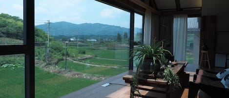 Premier Double Room, Garden View | Living area | 65-inch LED TV with digital channels, pay movies
