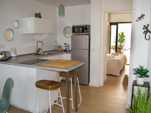 Fridge, microwave, coffee/tea maker, toaster