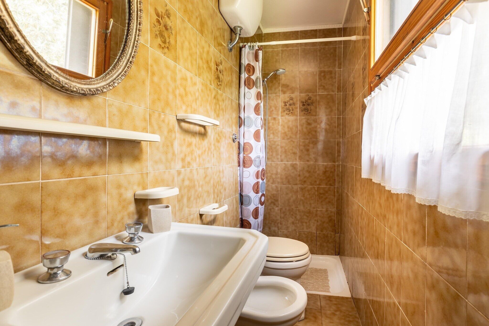 A bathroom with a bathtub, toilet, and shower.
