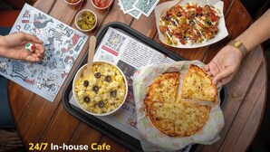 A tray with food items and a QR code on a wooden table. - goSTOPS Amritsar Chatiwind Gate  (Amritsar)