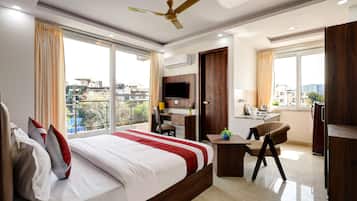 Deluxe Room with Kitchenette and Balcony | Egyptian cotton sheets, premium bedding, down duvets, memory-foam beds