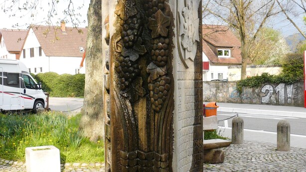A stone monument with intricate carvings, a cobblestone path, and a white van parked nearby. - Holiday Apartment '19sqm' with Wi-Fi in Quiet St. Georgen Backyard (Freiburg)