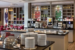 Enjoy a wide selection of food and beverages at our buffet, featuring a variety of dishes and refreshments.