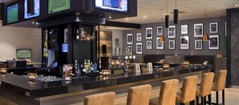A Comfortable Stay a Short Walk from the Terminal! Onsite Dining! Rooftop Bar