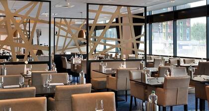 Minutes to Blijdorp Zoo, Steps to the Terminal! Onsite Dining, Airport View!