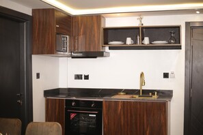 Standard Apartment, Balcony, City View | Private kitchen | Fridge, microwave, stovetop, cookware/dishes/utensils