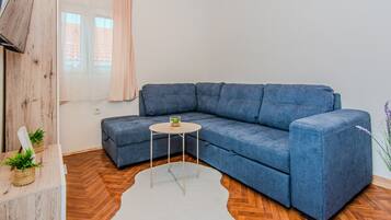 Standard Apartment, Balcony, Garden View | Living area | LCD TV
