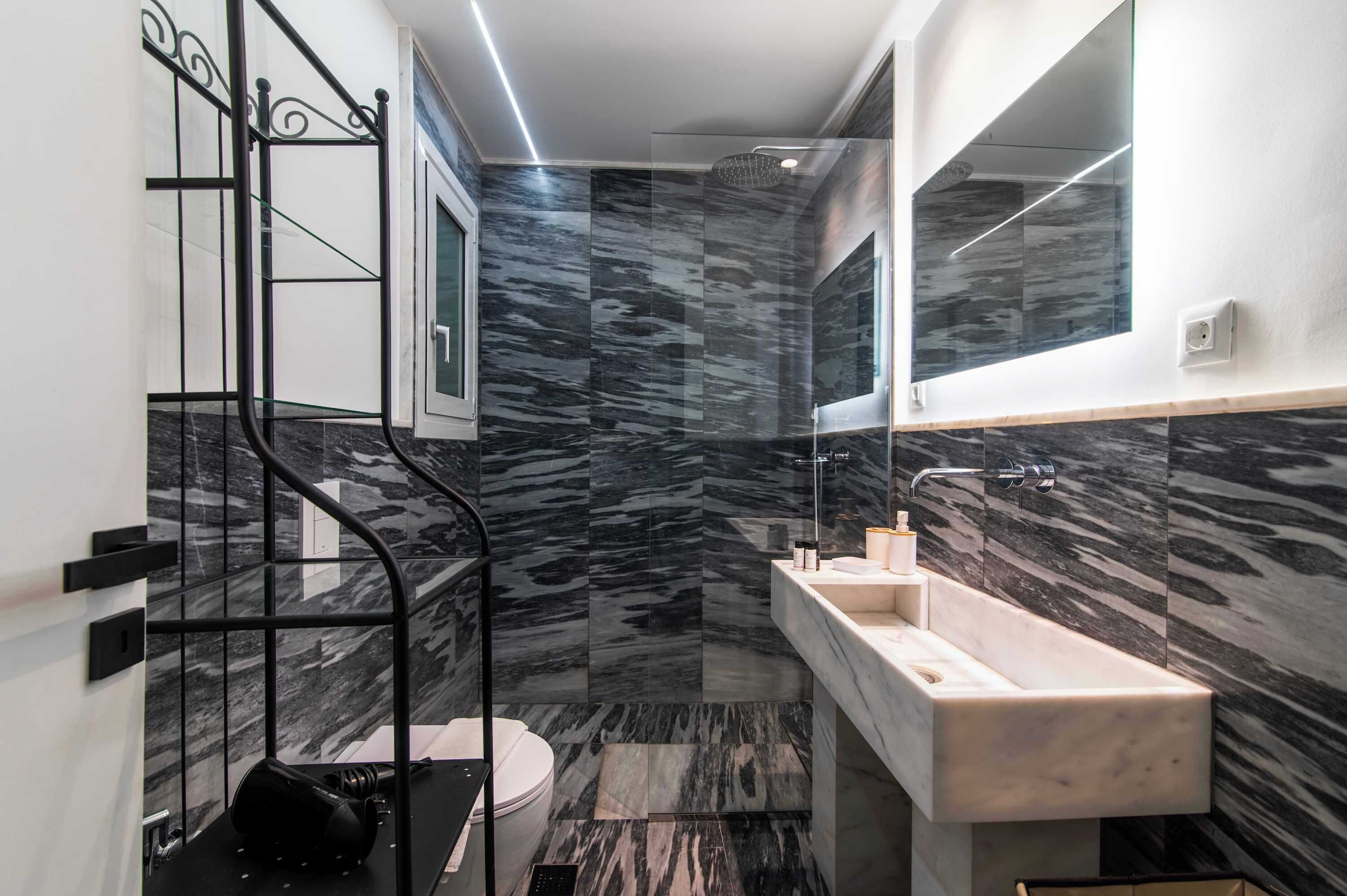 Shower, hair dryer, towels, shampoo