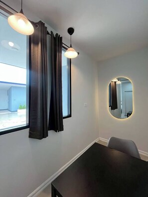 Desk, laptop workspace, free WiFi, bed sheets