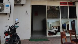 A building with a sign for Hotel Aditya Inn, offering both AC and non-AC rooms. - Hotel Aditya Inn (Jaipur)