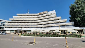 A multi-story hotel with a modern design, featuring balconies and a prominent signage. - Hotel Condor (Constanta)