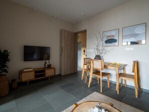 Suite presidencial, balcón, vista a la ciudad | Área de sala de estar