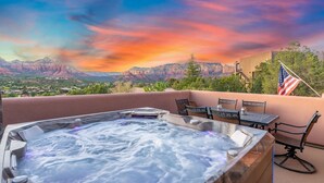 A hot tub with a view of mountains and an American flag. - Sycamore Canyon Luxe Retreat | 180° Views + Hottub (Sedona)