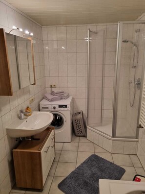 Shower, hair dryer, towels